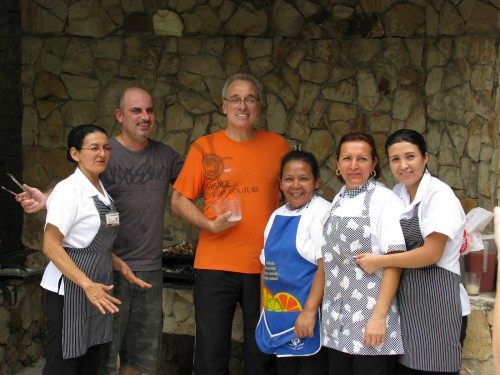 George (grey top), Enrique (orange top) and the kitchen staff