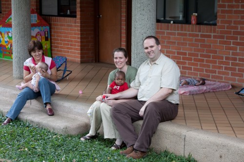 Sitting in the courtyard with the other infants