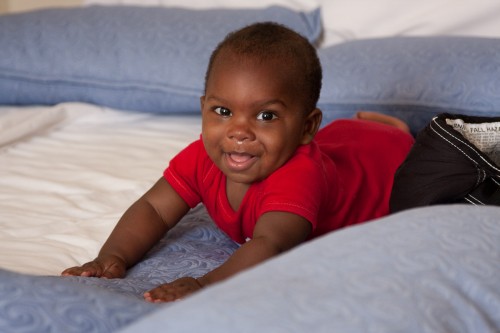 Andres playing on the bed