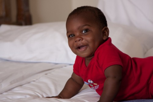 Andres playing on the bed