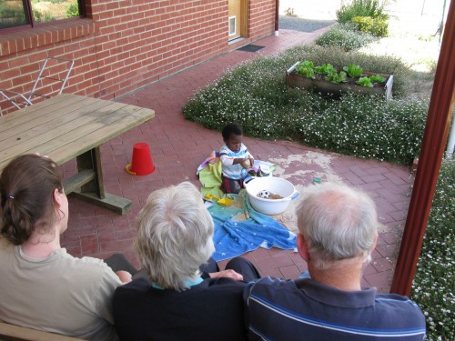 Watching Andres play in the backyard